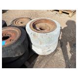 Pallet of (11) Industrial tires and rims, likely for heavy yard equipment