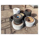 Pallet of Industrial tires and rims, likely for heavy yard equipment