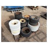 Pallet of Industrial tires and rims, likely for heavy yard equipment