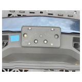 Vehicle Front Bumper Assembly w/ fog light openings, license plate mounting bracket and two-tone color scheme.