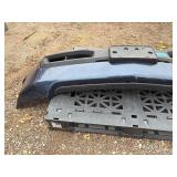 Vehicle Front Bumper Assembly w/ fog light openings, license plate mounting bracket and two-tone color scheme.