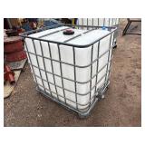 Plastic tank inside a metal cage. L 39 ½” x W 47” x H 46”
