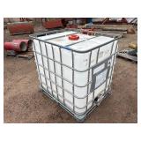 Plastic tank inside a metal cage L 39 ½” x W 47” x H 46”