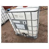 Plastic tank inside a metal cage L 39 ½” x W 47” x H 46”