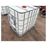 Plastic tank inside a metal cage L 39 ½” x W 47” x H 46”