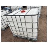 Plastic tank inside a metal cage L 39 ½” x W 47” x H 46”