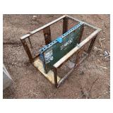 Steel mesh security cage on casters for easy mobility and forklift attachment rack