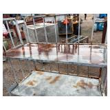 Metal rolling storage cart or cage with two fixed shelves 70” x 48”