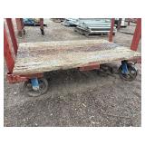 (2) Industrial flatbed carts/dollies with wood plank deck and caster wheels. Includes central lifting eye