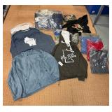 5 shelves of mostly Minnesota shirts, sweatshirts & jackets