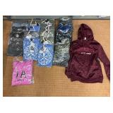 5 shelves of MN, WI, Iowa apparel various sizes designs & colors