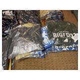 5 shelves of MN, WI, Iowa apparel various sizes designs & colors