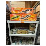 Crossbow and everything  on that shelf plus All Blow darts on floor