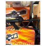 Crossbow and everything  on that shelf plus All Blow darts on floor