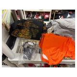 Shirts, sweatshirts, shot glasses, blankets, wallets, winter hats, incense, decals, flash lights, bracelets