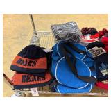 Winter hats, baseball caps and flags (top shelf)