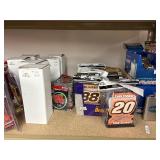 NASCAR lighters, cars, shirts, can coolers, blankets, flasks, desk set, hats, and license plates