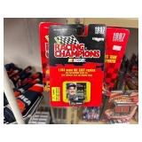 NASCAR lighters, cars, shirts, can coolers, blankets, flasks, desk set, hats, and license plates