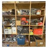 3 shelves of camo/orange hunting gear. Jackets, sweatshirts, hats, foam footballs
