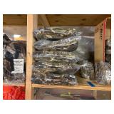 3 shelves of camo/orange hunting gear. Jackets, sweatshirts, hats, foam footballs