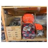 3 shelves of camo/orange hunting gear. Jackets, sweatshirts, hats, foam footballs