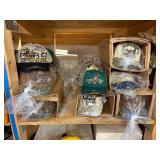 3 shelves of camo/orange hunting gear. Jackets, sweatshirts, hats, foam footballs