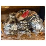 3 shelves of camo/orange hunting gear. Jackets, sweatshirts, hats, foam footballs