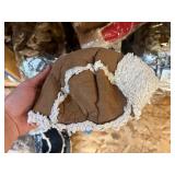 3 shelves of camo/orange hunting gear. Jackets, sweatshirts, hats, foam footballs