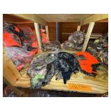 3 shelves of camo/orange hunting gear