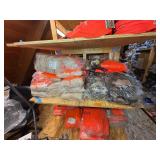 3 shelves of camo/orange hunting gear