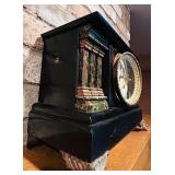 LL - Antique Black Mantel Clock with Ornate Metal Feet