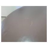 A Modern Round Brown Leather Coffee Table / Ottoman by Room and Board.