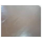 A Modern Round Brown Leather Coffee Table / Ottoman by Room and Board.