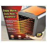 New Handy Heater Pure Warmth Ceramic Space Heater with LED Lights