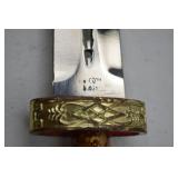 Decorative Dagger With Ornate Sheath and Lion Head Pommel