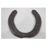 Decorative horseshoe with musical notes and TPJ initials
