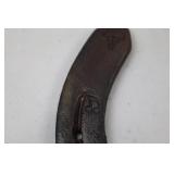 Decorative horseshoe with musical notes and TPJ initials