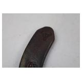 Decorative horseshoe with musical notes and TPJ initials