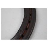 Decorative horseshoe with musical notes and TPJ initials