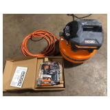 RIDGID 6 Gal. 150 PSI Portable Electric Oil-Free Jobsite Pancake Air Compressor with 25 ft. Air Hose and 18GA Brad Nailer Customer Returns See Pictures