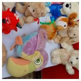 Lot of Plush Toys Including a Colorful Toucans, Bears, and a Red Devil Doll