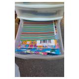 Craft Supplies In Plastic Cabinet, Wrapping Paper
