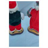 Animated Santa and Mrs. Claus Figures with Santa Face Decoration