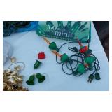 Holiday Lighting and Decorations Lot including Bubble Lights, 100 Green Mini Lights, 100 Purple Mini Lights, and Assorted String Lights
