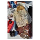 Assorted household and miscellaneous items including fabrics, salsa mix, weights, tobacco tubes, and small tools