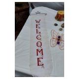 Welcome Sign with Butterfly Design, Santa Figurine, and Assorted Decorative Items