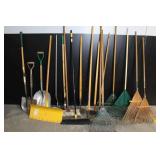 Large Assortment of Lawn and Garden Tools Including Rakes, Shovels, Hoes, and Brooms