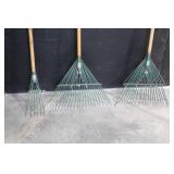 Large Assortment of Lawn and Garden Tools Including Rakes, Shovels, Hoes, and Brooms