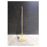 Large Assortment of Lawn and Garden Tools Including Rakes, Shovels, Hoes, and Brooms