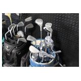 Collection of Vintage Golf Clubs with Bags and Pull Cart